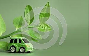 Ecology concept. Eco car on a green background. The concept of sustainable development. Copy space