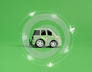 Ecology concept. Green car and environmental signs on a green background. Environment concept