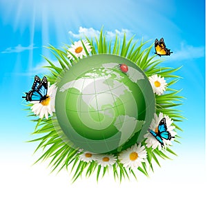 Ecology concept.Green Globe and Grass with Flowers.