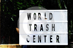 Ecology concept. World trash center writing on vintage style lightbox in a store window. Zero Waste.