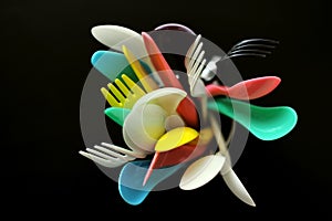 Ecology conceptual photography with plastic cutlery on a black background