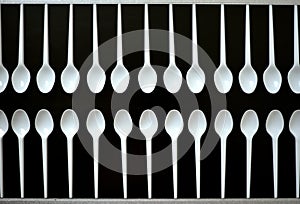 Ecology conceptual photography with plastic cutlery on a black background