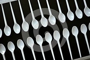 Ecology conceptual photography with plastic cutlery on a black background