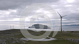 Ecology and energy. Wind generators. Oceanic wind turbines at the coastal windmill farm. Green energy. Modern green