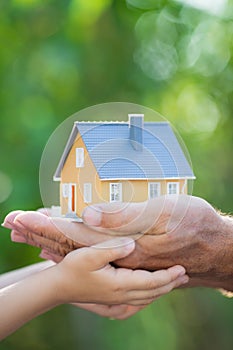 Ecology house in hands