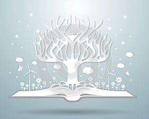 Ecology winter concept,paper tree growing from an open book