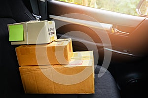 Ecommerce delivery shopping online and order concept / shipping shopping online cardboard box on car seat