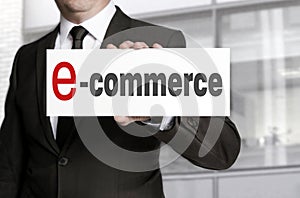 Ecommerce sign held by businessman