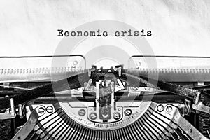 Economic Crisis text typed on vintage typewriter. Business finance