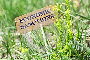 Economic sanctions wooden sign