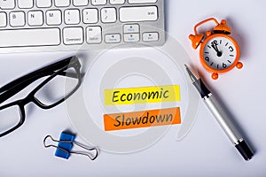 Economic slowdown - message at busninessman workplace. High unemployment and Economic stagnation