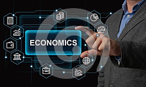 Economics concept. Man in suit holding inscription