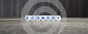 Economy boggle word cubes on dark background