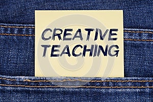 There is a paper sticking out of a jeans pocket with the inscription - Creative Teaching photo
