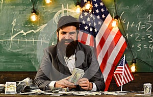 Economy and finance. Patriotism and freedom. Income planning of budget increase policy. Bearded man with dollar money