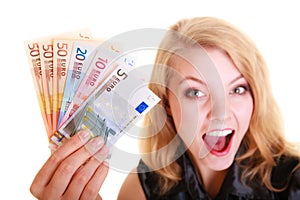 Economy finance. Woman holds euro currency money.