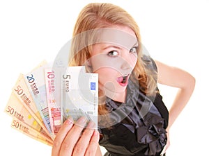 Economy finance. Woman holds euro currency money.