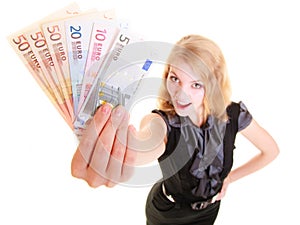 Economy finance. Woman holds euro currency money.