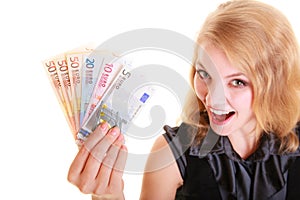 Economy finance. Woman holds euro currency money.