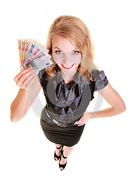 Economy finance. Woman holds euro currency money.