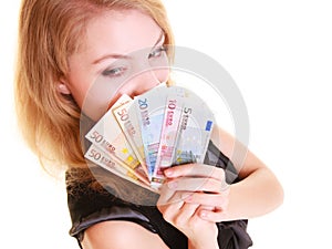 Economy finance. Woman holds euro currency money.