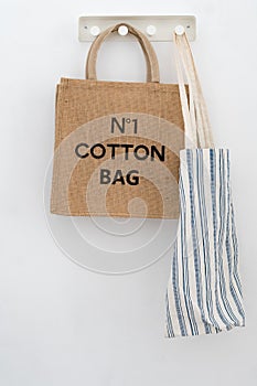 Ecoproduct. Eco-friendly grocery Bags on a white wall background photo