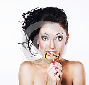 Ecstasy. Funny Peppy Woman with Yummy Lollipop photo