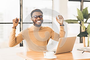 Ecstatic black guy celebrating his success at work