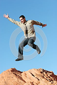 Ecstatic business man jumping photo