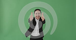 Ecstatic businessman giving thumbs up gesture