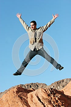 Ecstatic businessman jumping photo