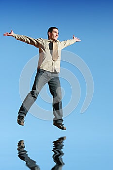 Ecstatic businessman jumping i