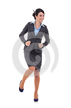 Ecstatic businesswoman in suit dancing