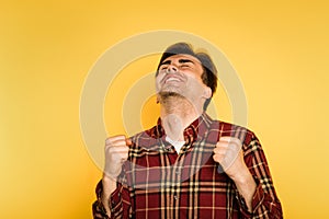 Ecstatic delighted man celebrating success emotion