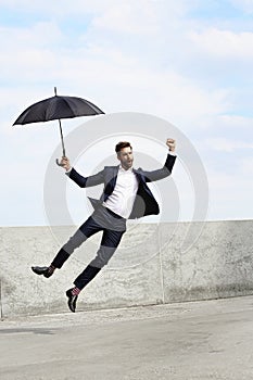 Ecstatic jumping businessman