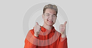 Ecstatic man giving thumbs up gesture