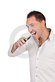 Ecstatic man holding a mobile and laughing