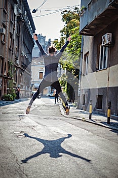 Ecstatic man jumping on the street