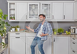 Ecstatic man in the kitchen