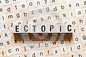 Ectopic word concept on cubes photo