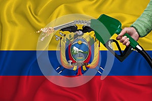 ECUADOR flag Close-up shot on waving background texture with Fuel pump nozzle in hand. The concept of design solutions. 3d