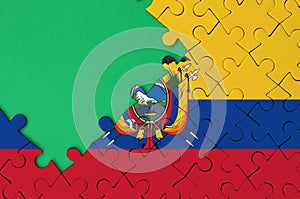 Ecuador flag is depicted on a completed jigsaw puzzle with free green copy space on the left side