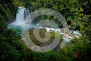 Ecuador waterfall, river with white stream, rainy day, green vegetation in national park Sumaco. Green tropical forest, with