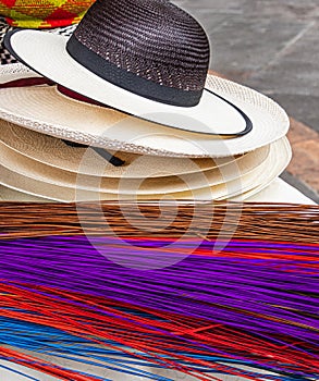 Ecuadorian handmade Paja Toquilla straw hats and a colored straw photo