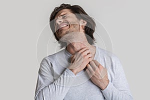 Eczema concept. Man suffers from skin irritation photo