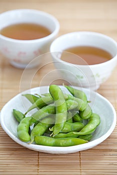 Edamame nibbles, boiled green soy beans