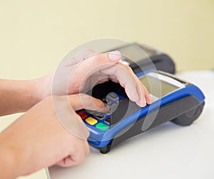 EDC ( electronic Data Capture) machine hand pressing password on