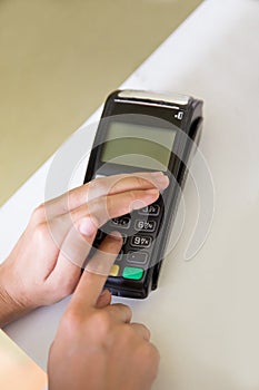 EDC ( electronic Data Capture) machine hand pressing password on