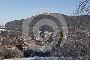 Eddigehausen in the snow with castle ruins Plesse castle