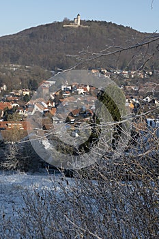 Eddigehausen in the snow with castle ruins Plesse castle